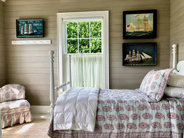 Nantucket guest house bedroom with ship dioramas